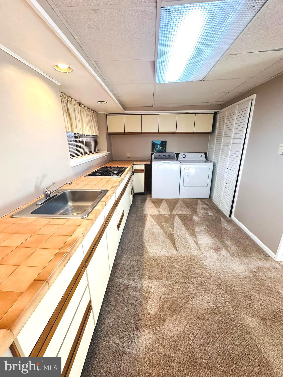 8601 Kenilworth Drive Springfield, VA 22151 - Photo 37 of 47 a bathroom with a tub sink and mirror