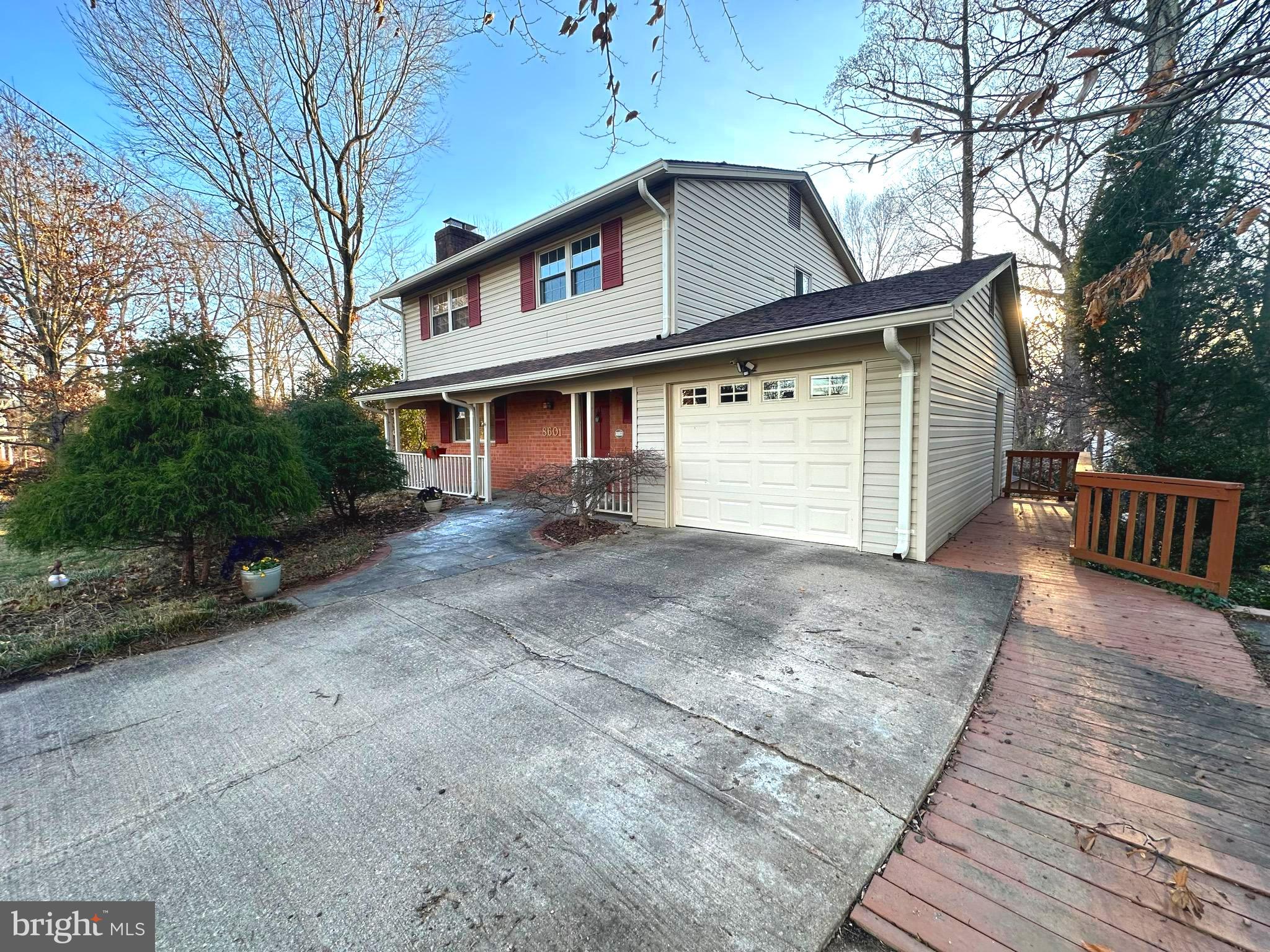 8601 Kenilworth Drive Springfield, VA 22151 - Photo 39 of 47 a front view of house with a garden