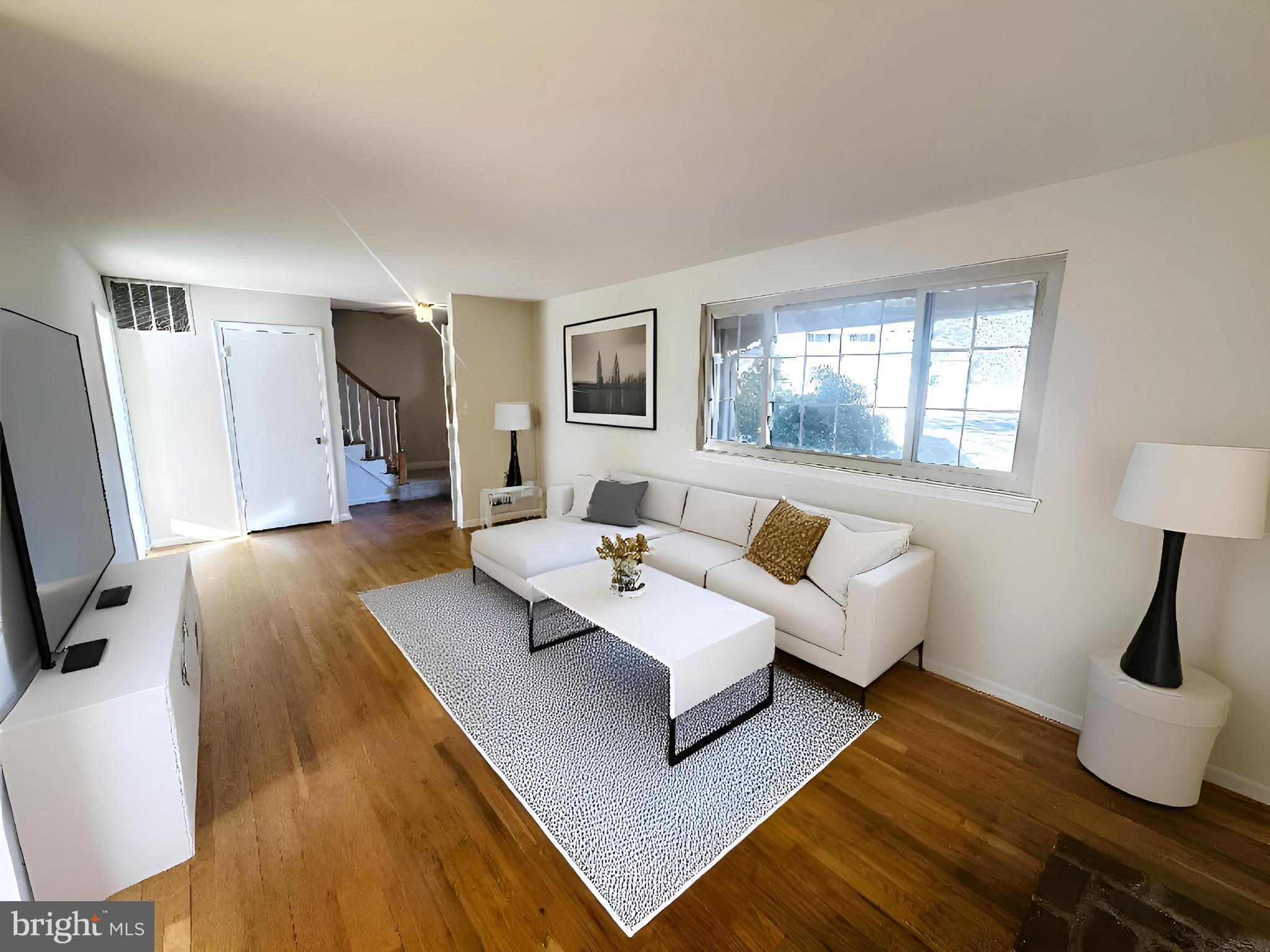 8601 Kenilworth Drive Springfield, VA 22151 - Photo 4 of 47 a living room with furniture and a flat screen tv