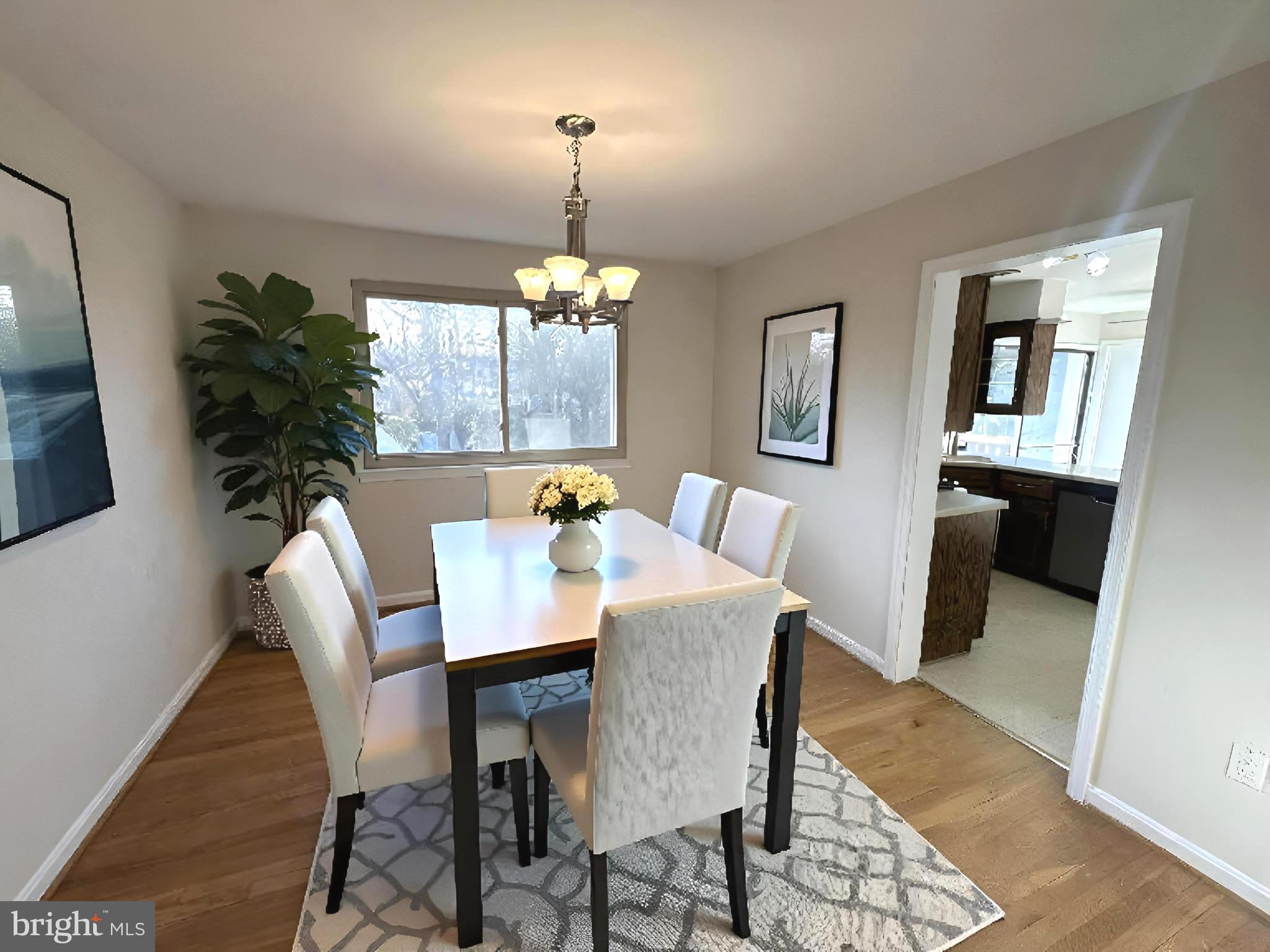 8601 Kenilworth Drive Springfield, VA 22151 - Photo 6 of 47 a view of a dining room with furniture and chandelier