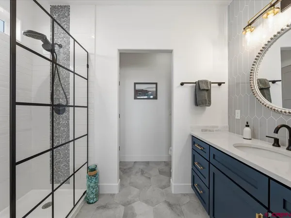 a bathroom with a sink and mirror