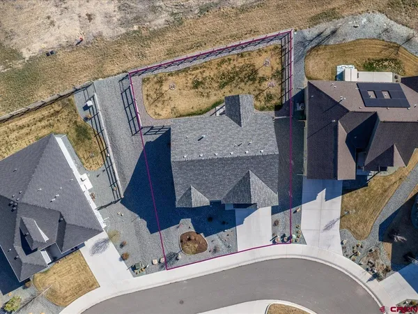 an aerial view of a house with a ocean view