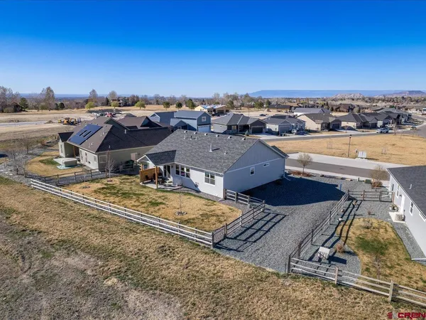 an aerial view of a house with a ocean view