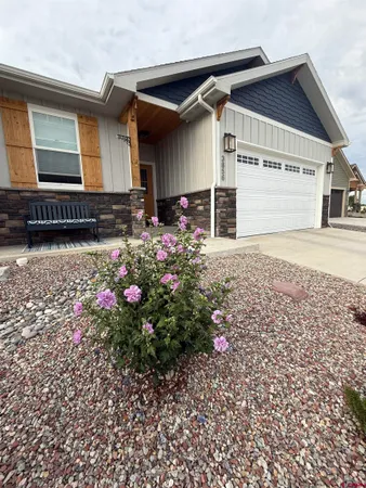 a front view of house with a yard