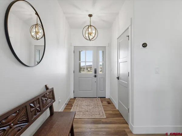 a view of a hallway with washer and dryer