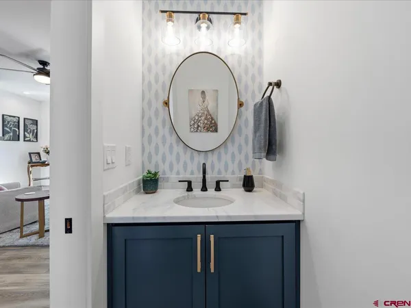 a bathroom with a sink and a mirror