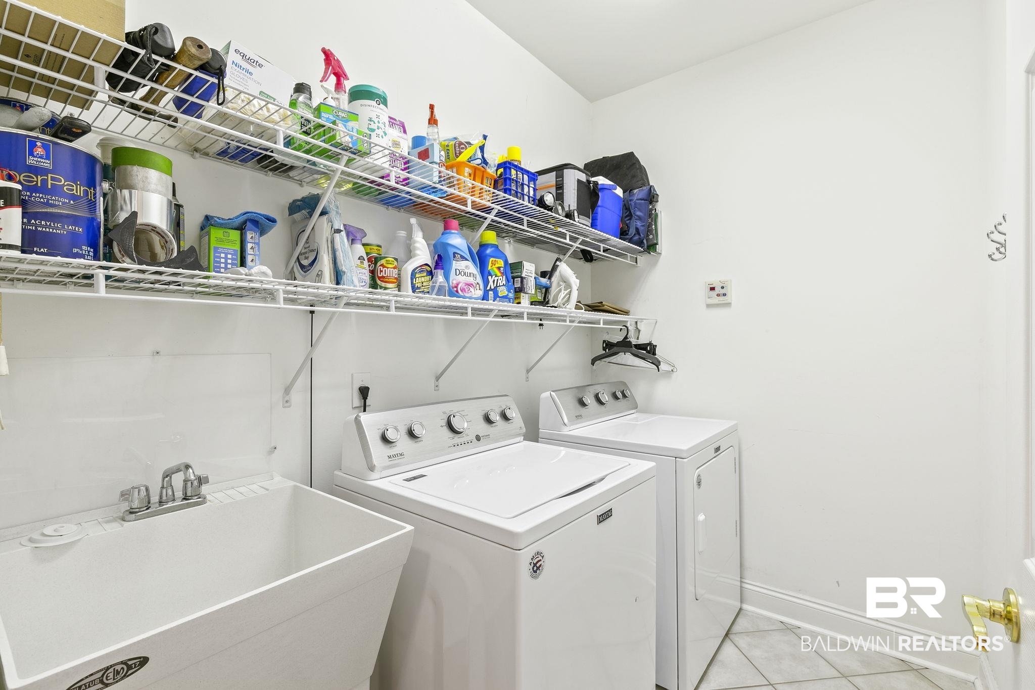 22512 Inverness Way Foley, AL 36535 - Photo 34 of 43 Clothes washing area with washer and clothes dryer, sink, and light tile patterned floors