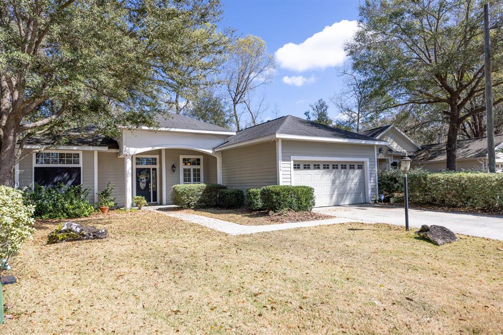 8326 Southwest 8 Place Gainesville, FL 32607 - Photo 1 of 1 a front view of house with yard and green space