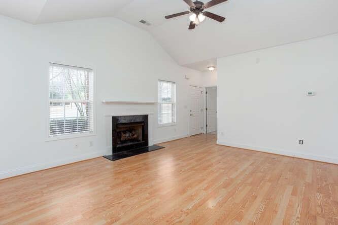 3402 Raes Creek Road, Unit 27 Marietta, GA 30008 - Photo 10 of 32 an empty room with windows and fireplace