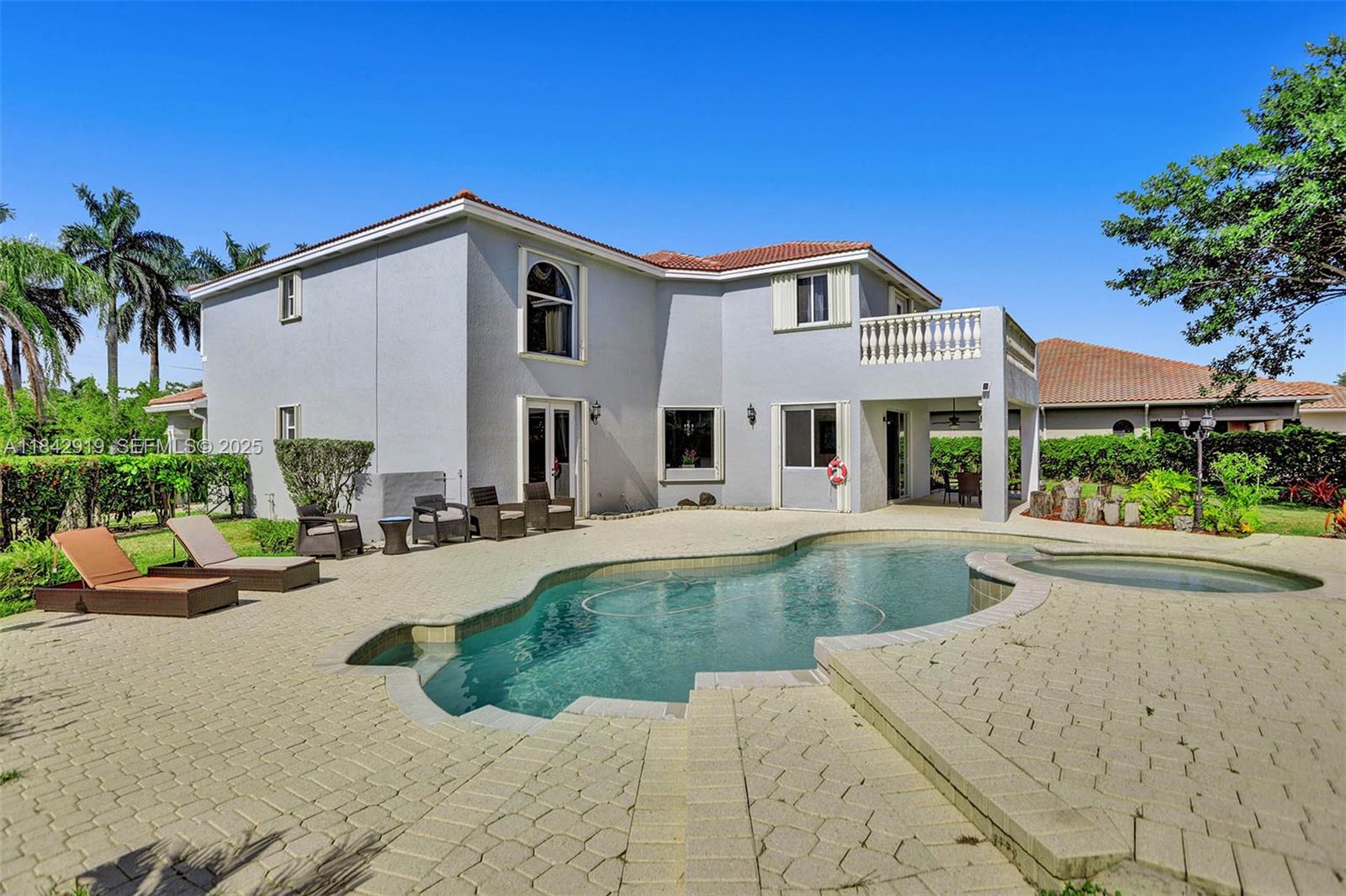 721 Ranch Road Weston, FL 33326 - Photo 12 of 38 a view of a house with backyard and sitting area