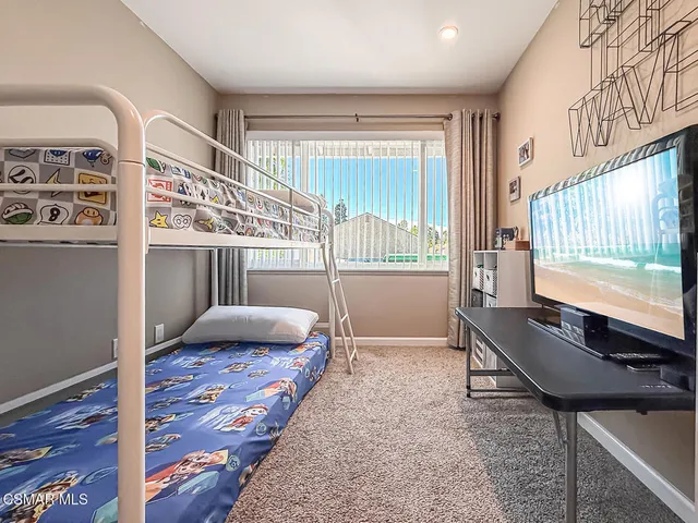 a living room with a couch and a window