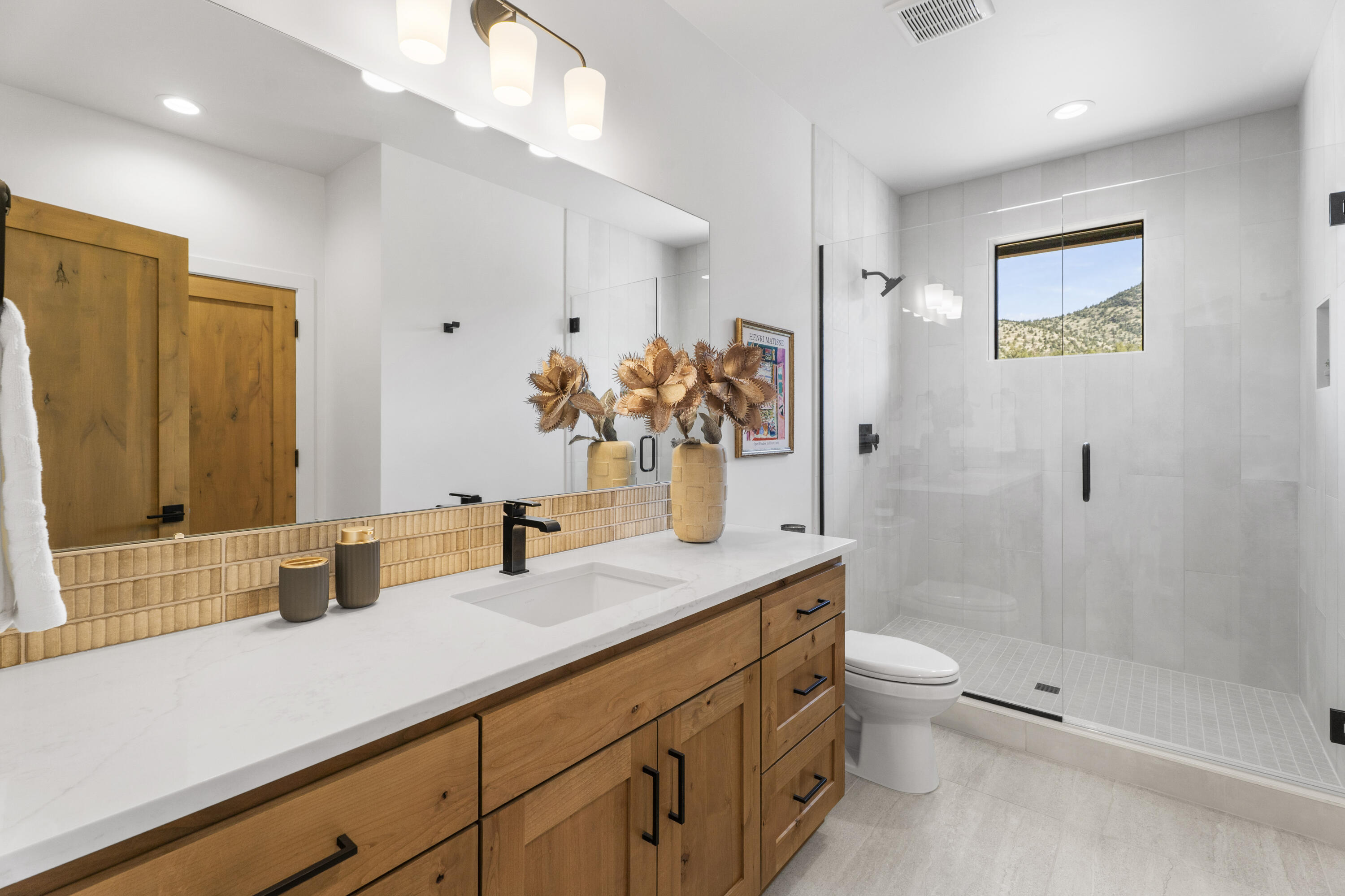 16883 Southwest Paragon Court Powell Butte, OR 97753 - Photo 12 of 42 The ground floor offers a full bathroom for overnight guests and day visitors alike