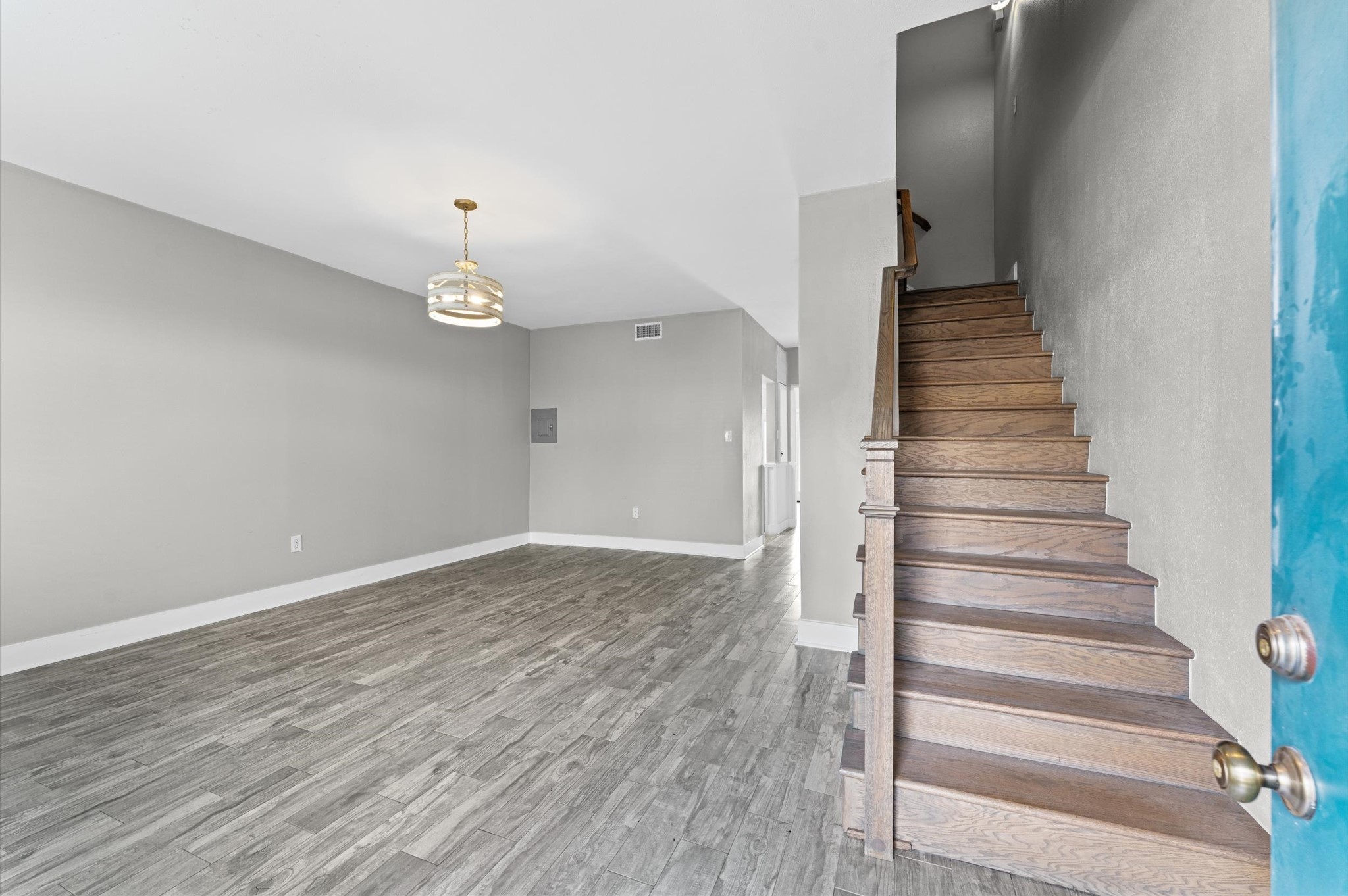 830 Threadneedle Street, Unit 240 Houston, TX 77079 - Photo 5 of 24 Welcome Home! The 17 x 20 living room is both inviting & accommodating! There's additional storage space under the staircase.