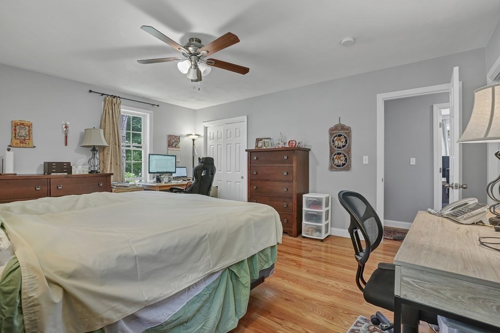 18 Castleton Avenue Randolph, MA 02368 - Photo 11 of 25 a bed room with bed and a chair