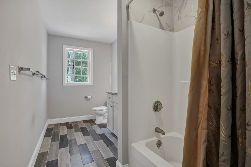 18 Castleton Avenue Randolph, MA 02368 - Photo 16 of 25 a bathroom with a bathtub and a shower