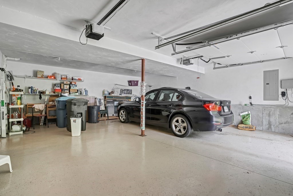 18 Castleton Avenue Randolph, MA 02368 - Photo 20 of 25 a view of parking garage with cars and other equipment