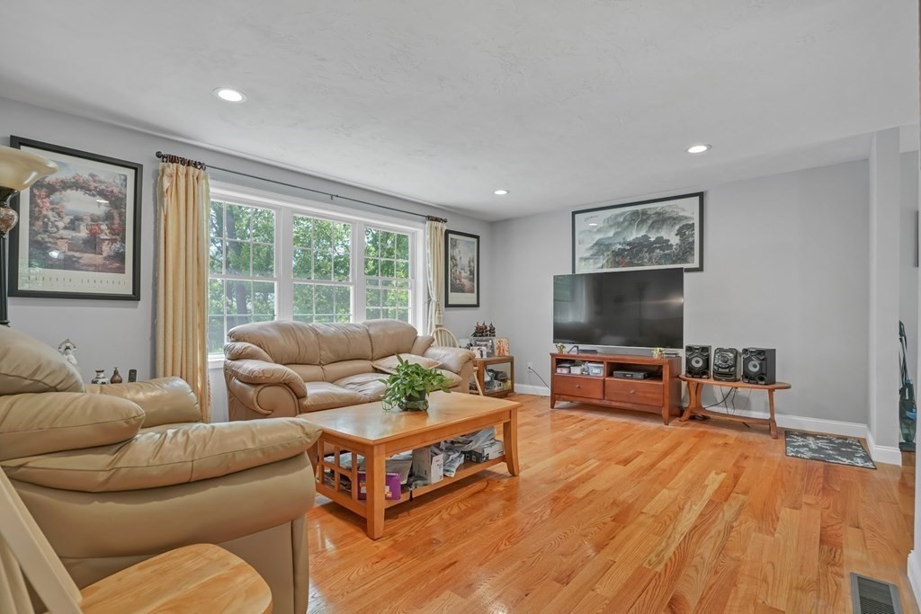 18 Castleton Avenue Randolph, MA 02368 - Photo 2 of 25 a living room with furniture and a flat screen tv