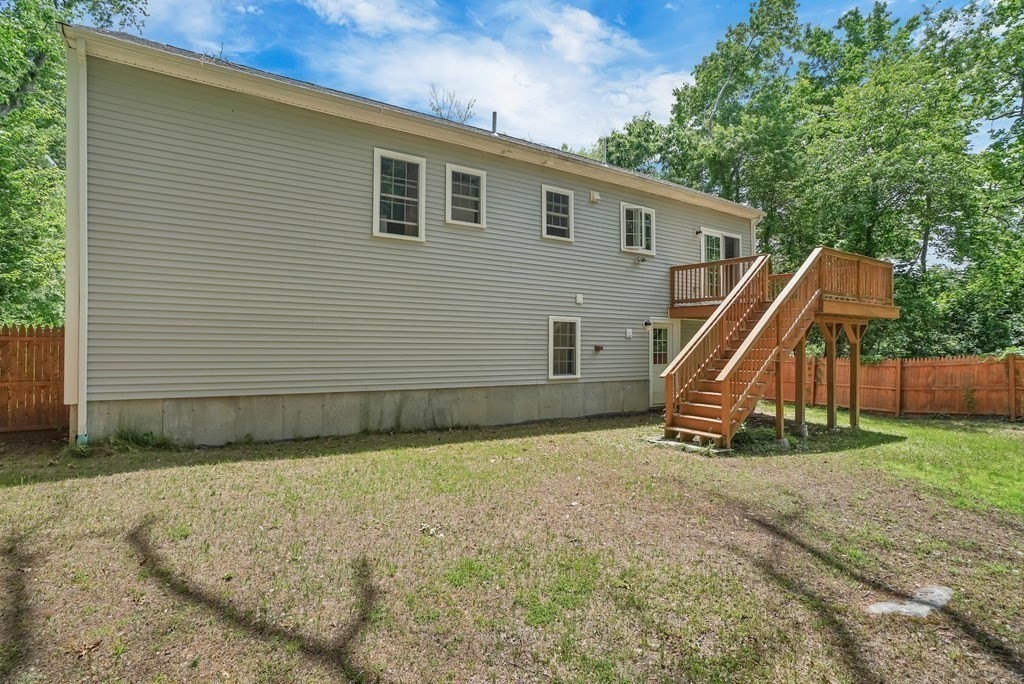 18 Castleton Avenue Randolph, MA 02368 - Photo 24 of 25 a view of a house with a backyard