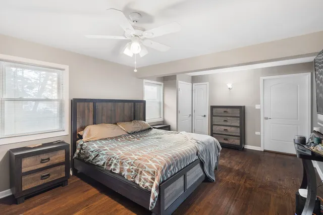 a bedroom with a bed and a dresser