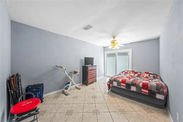 a bedroom with bed and a window