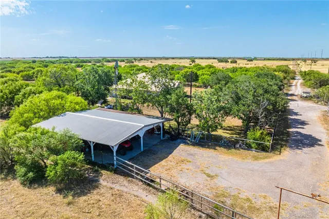 a view of a chairs and table in the patio