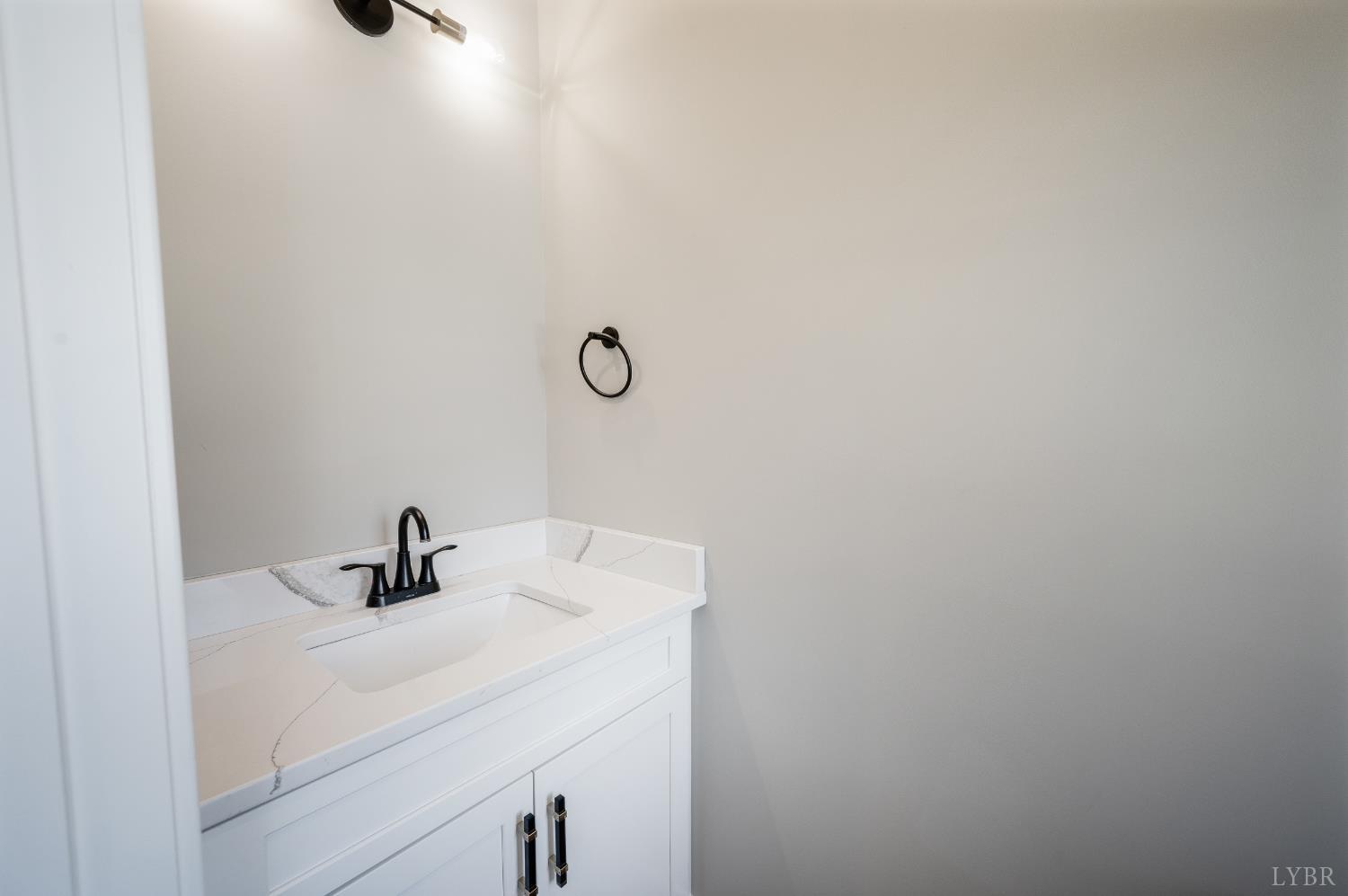 57 Luke Court Rustburg, VA 24588 - Photo 18 of 41 a bathroom with a sink and mirror