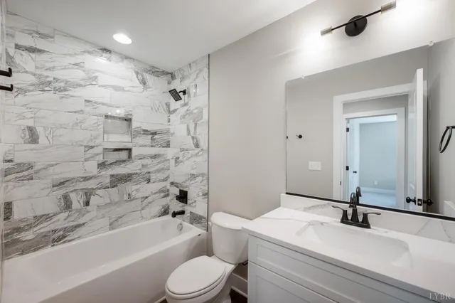 a bathroom with a sink a toilet and a bathtub