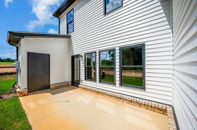 a view of a white house with a large windows