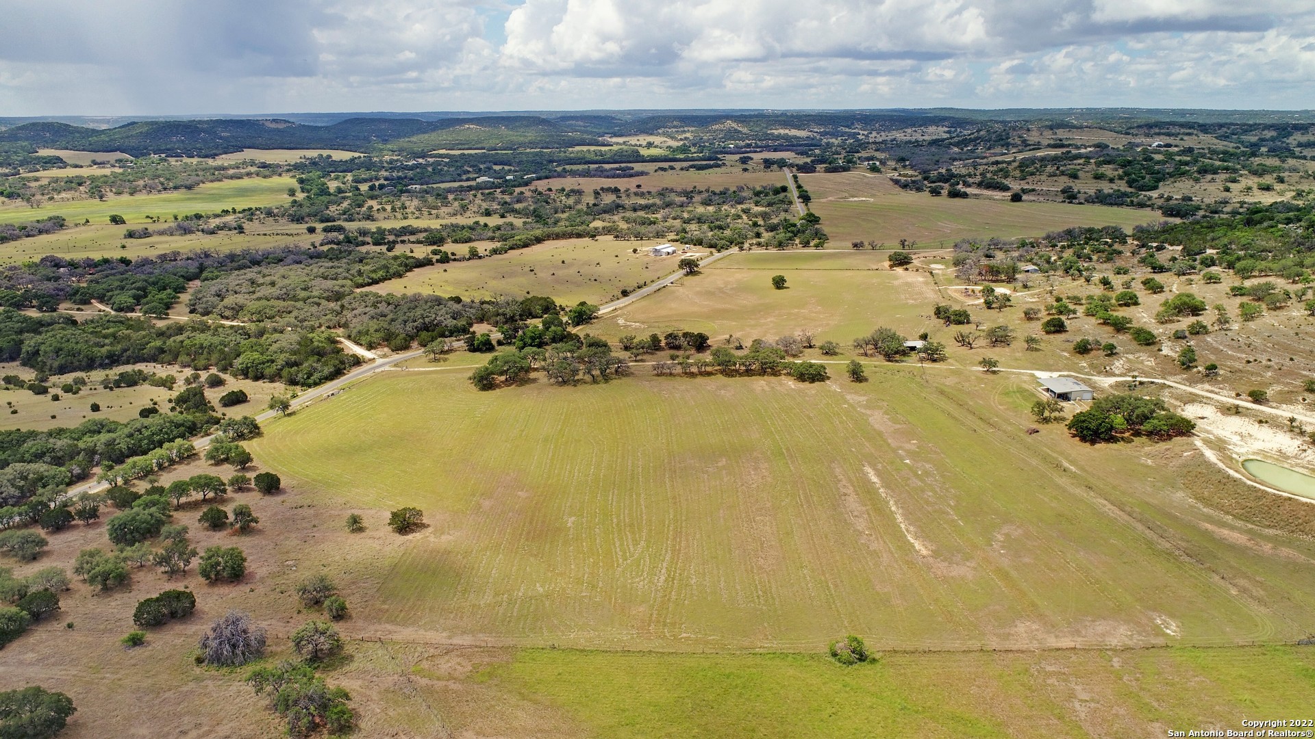 an aerial view of residential building and ocean