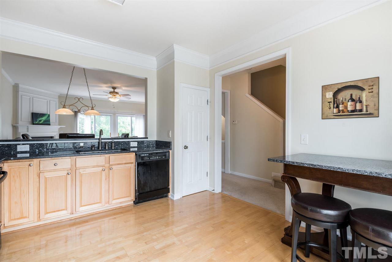 5522 Shady Crest Drive Raleigh, NC 27613 - Photo 11 of 25 a kitchen with granite countertop cabinets and chair