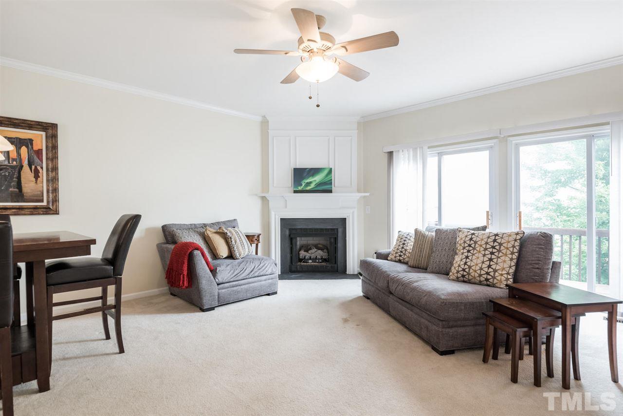 5522 Shady Crest Drive Raleigh, NC 27613 - Photo 12 of 25 a living room with furniture and a fireplace