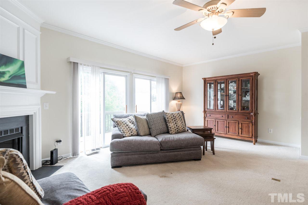5522 Shady Crest Drive Raleigh, NC 27613 - Photo 14 of 25 a living room with furniture and a window