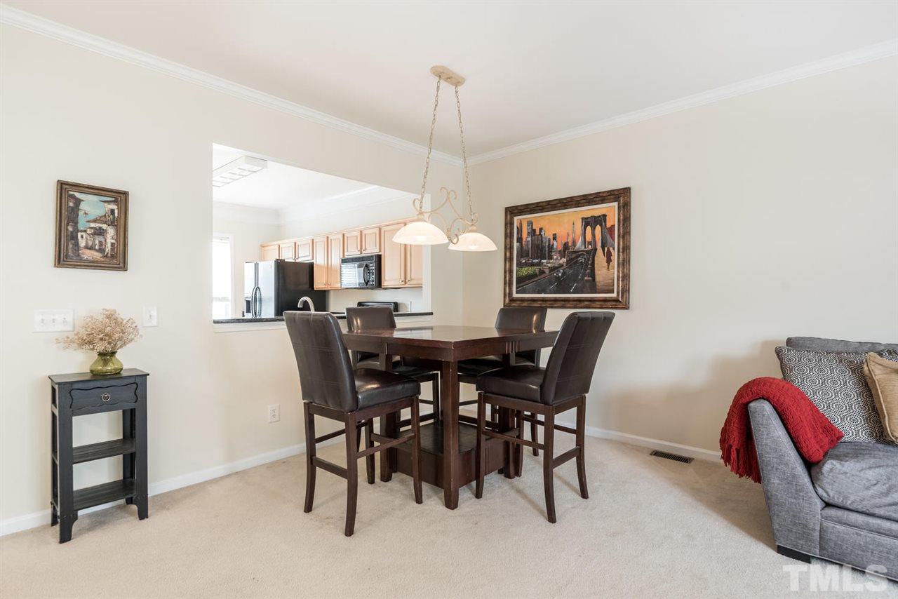 5522 Shady Crest Drive Raleigh, NC 27613 - Photo 15 of 25 a view of a dining room with furniture