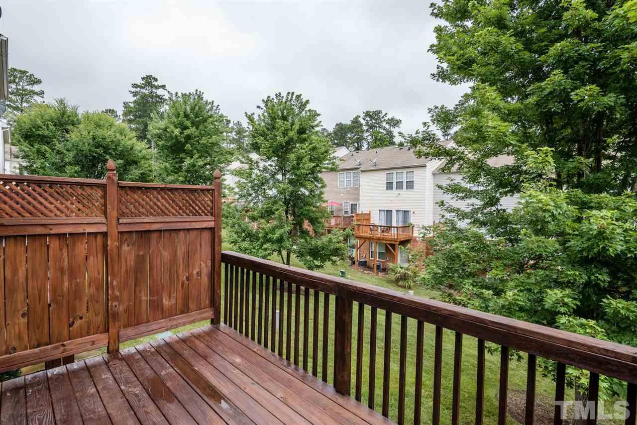 5522 Shady Crest Drive Raleigh, NC 27613 - Photo 19 of 25 a balcony with wooden floor and fence