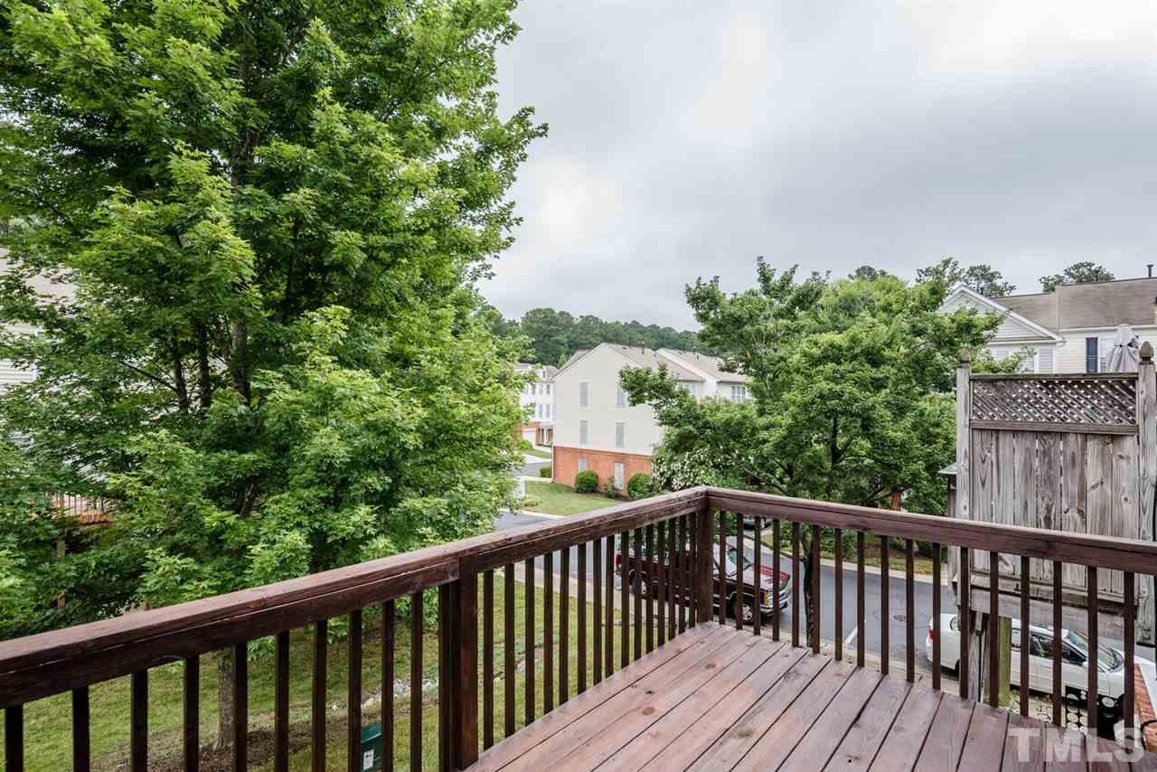 5522 Shady Crest Drive Raleigh, NC 27613 - Photo 20 of 25 a view of a balcony with wooden floor