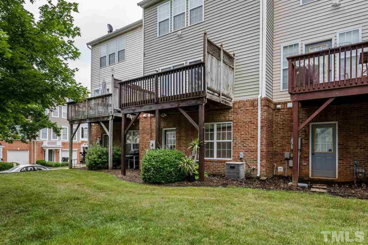 5522 Shady Crest Drive Raleigh, NC 27613 - Photo 23 of 25 a view of a brick house with a yard and plants