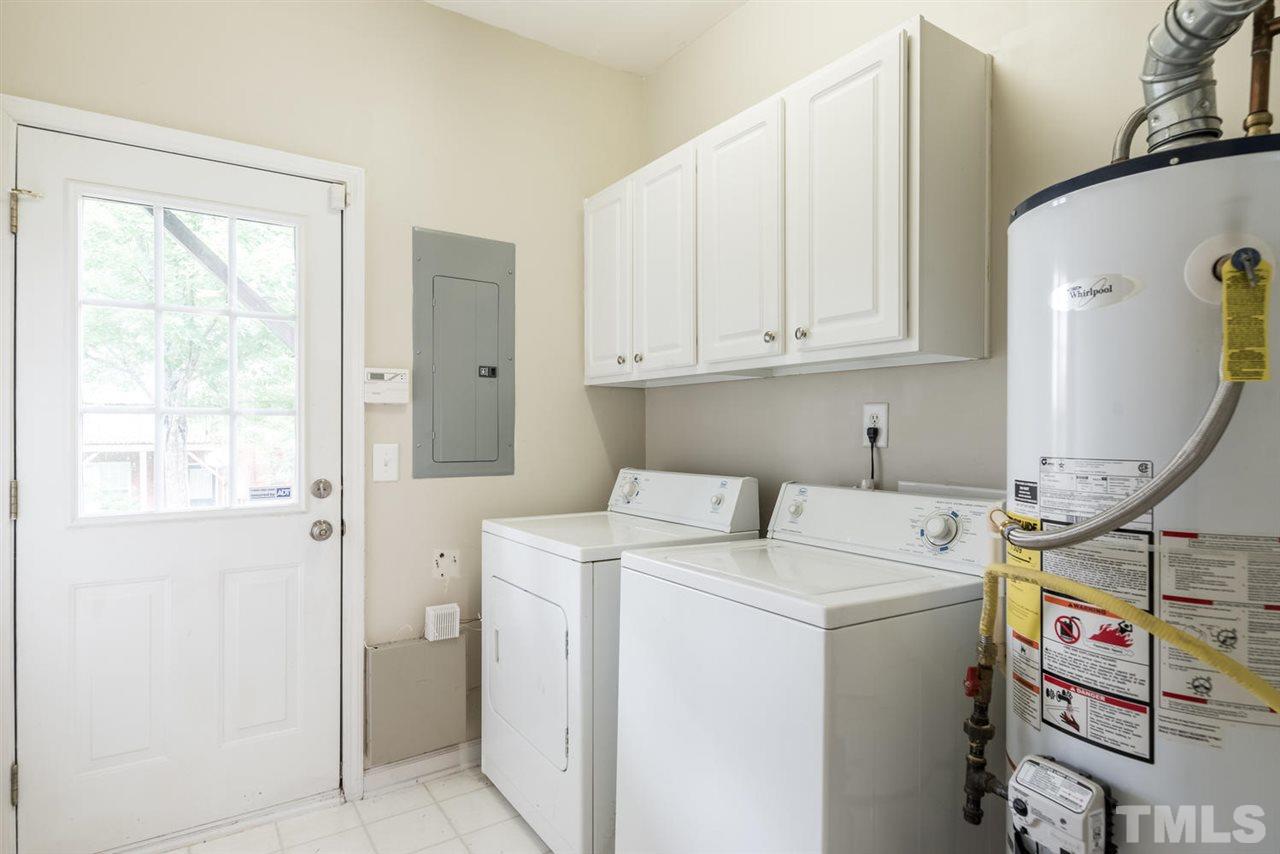 5522 Shady Crest Drive Raleigh, NC 27613 - Photo 25 of 25 a utility room with dryer and washer
