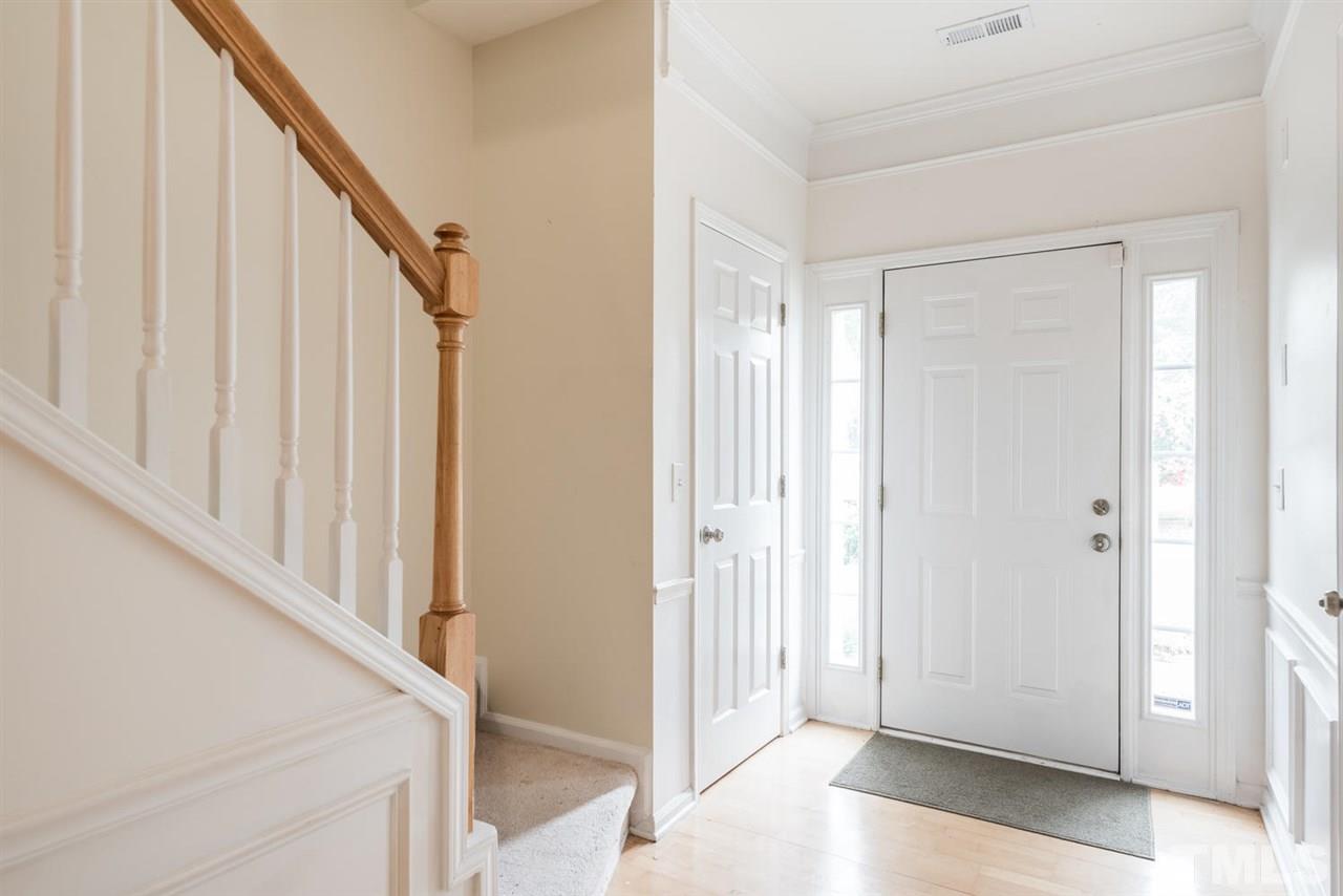 5522 Shady Crest Drive Raleigh, NC 27613 - Photo 5 of 25 a view of a livingroom with wooden floor and staircase
