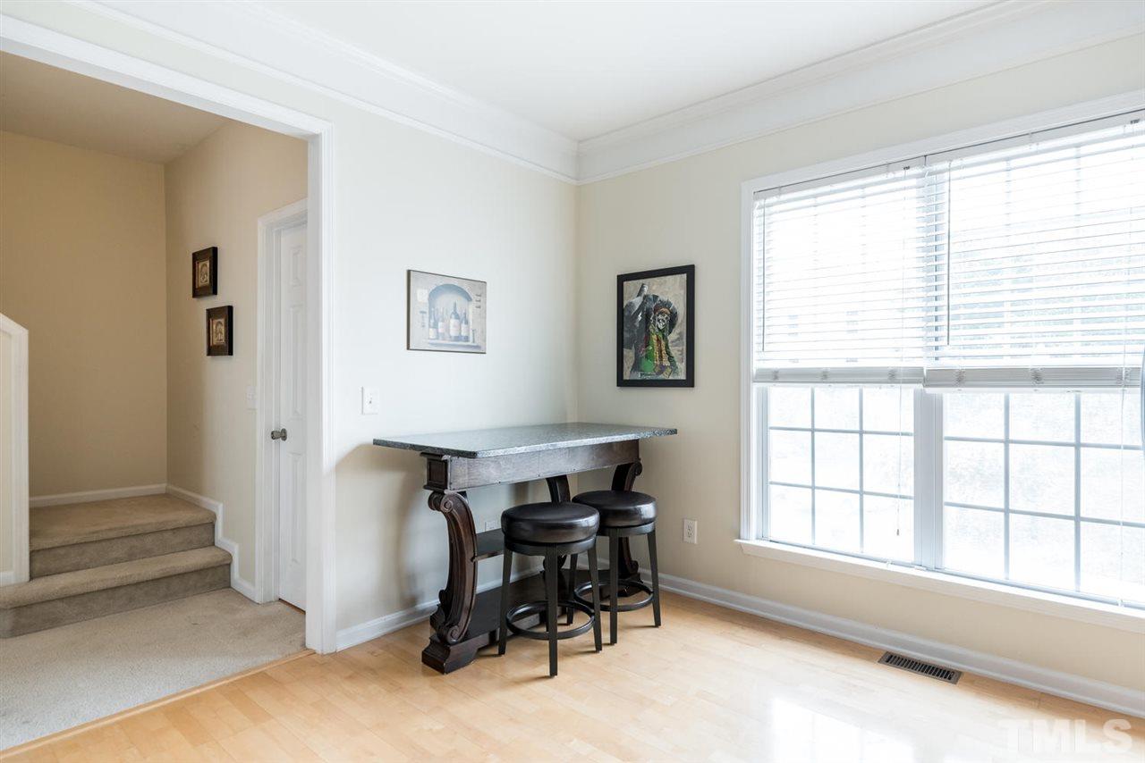 5522 Shady Crest Drive Raleigh, NC 27613 - Photo 9 of 25 a view of a workspace with furniture and a window