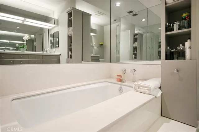 a bathroom with a bathtub and a sink