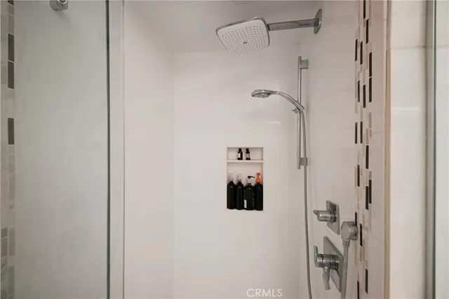 a bathroom with a shower and a shower