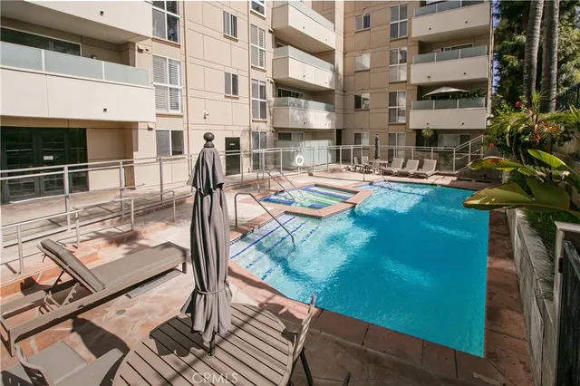 a view of a swimming pool with a patio