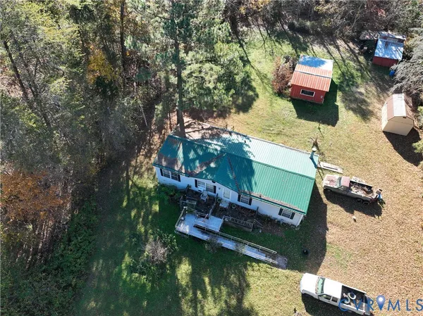 an aerial view of houses with yard
