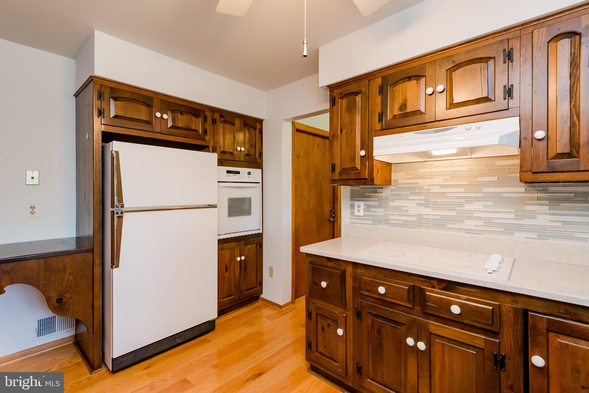 Kitchen- back splash and white cooktop