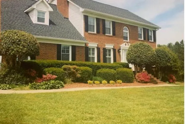 a front view of a house with a yard