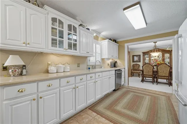 a living room with furniture and a lamp