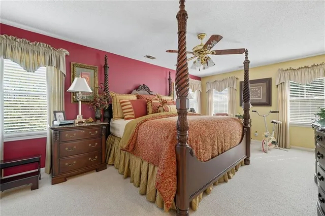 a bedroom with furniture and a flat screen tv