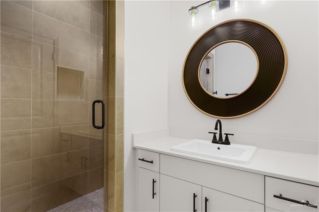 5321 Vision Street Rio Grande City, TX 78582 - Photo 19 of 34 a bathroom with a sink and mirror