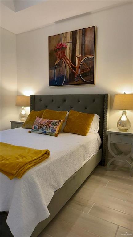 5321 Vision Street Rio Grande City, TX 78582 - Photo 24 of 34 a bedroom with a bed and painting on the wall