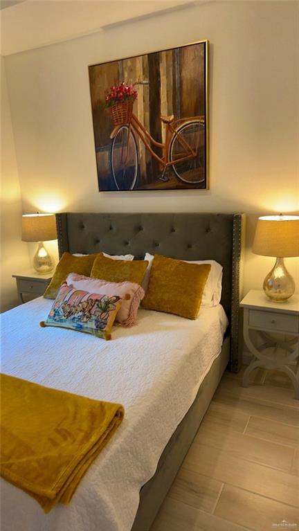 5321 Vision Street Rio Grande City, TX 78582 - Photo 31 of 34 a bedroom with a bed and wall painting